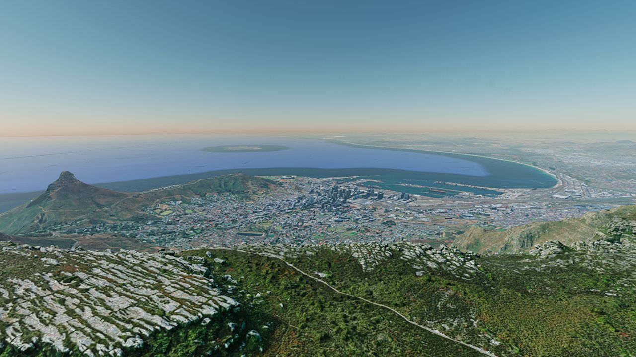 Cape Town seen from above Table Mountain: photoreal city, bay and a hazy horizon under a blue sky.